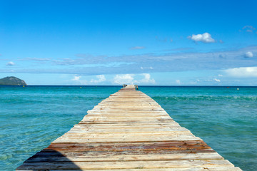 A wooden pier at Playa de Muro beach in Mallorca