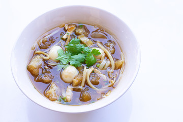 Braised fish maw in red gravy in bowl on white