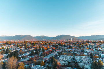 Autumn sunrise over the East Vancouver and view of downtown Brentwood, Burnaby with scenic...