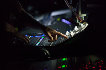 Console controller hand working during theatre play