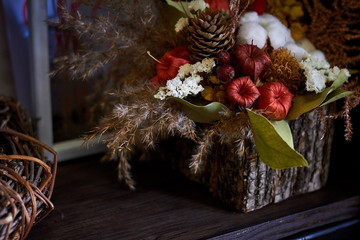 Close-up decorative autumn composition in a basket, selective focus
