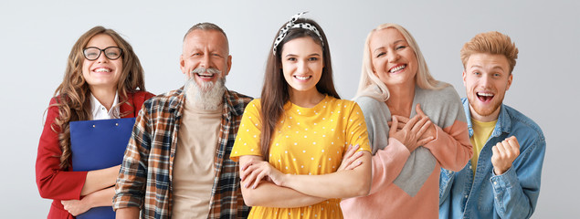 Different happy people on color background