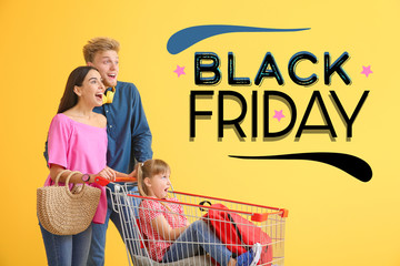 Family with shopping cart and text BLACK FRIDAY on color background