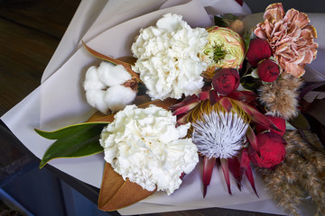 Close-up of bouquet details decorated in vintage style on a dark background, selective focus