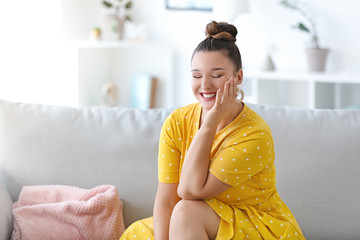 Young body positive woman at home