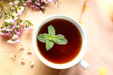 Cup of hot tea on tray, top view