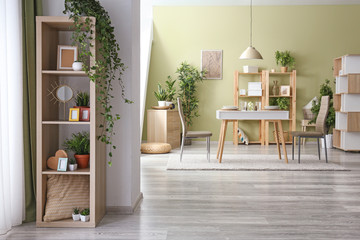 Interior of dining room with green houseplants