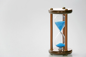 Crystal hourglass on light background