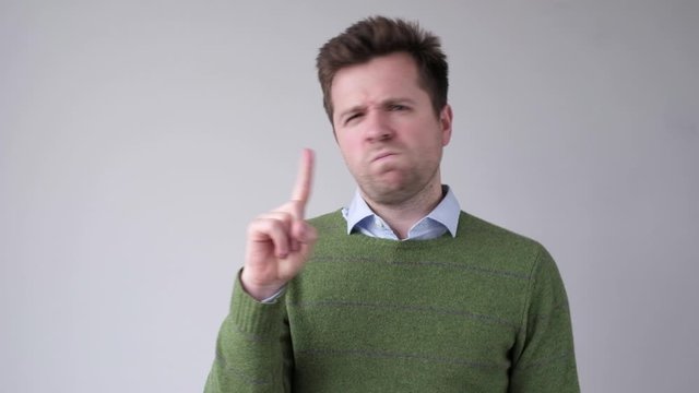 Attractive mature man showing refusal gesture. It is not for me