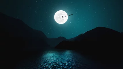 Rollo Santa Claus flying in his sleigh over the moon in beautiful landscape © Jess rodriguez