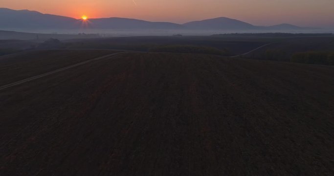 Aerial drone fly over northern Hungarian landscape at sunrise. Northern Matra mountains and hills.