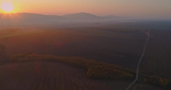 Aerial drone fly over northern Hungarian landscape at sunrise. Northern Matra mountains and hills.