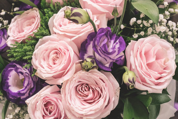 Close up of Violet and pink rose flower bouquet.