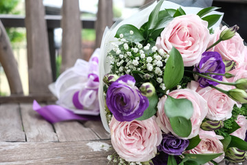 Close up of Violet and pink rose flower bouquet.