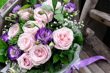 Close up of Violet and pink rose flower bouquet.