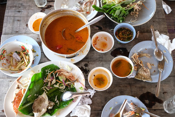 Leftover food on the wooden table.