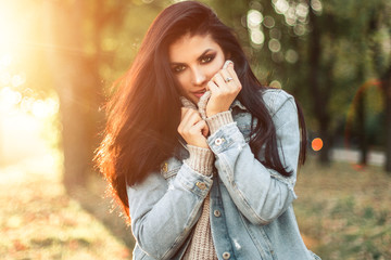 Beautiful model posing for the camera in the park.