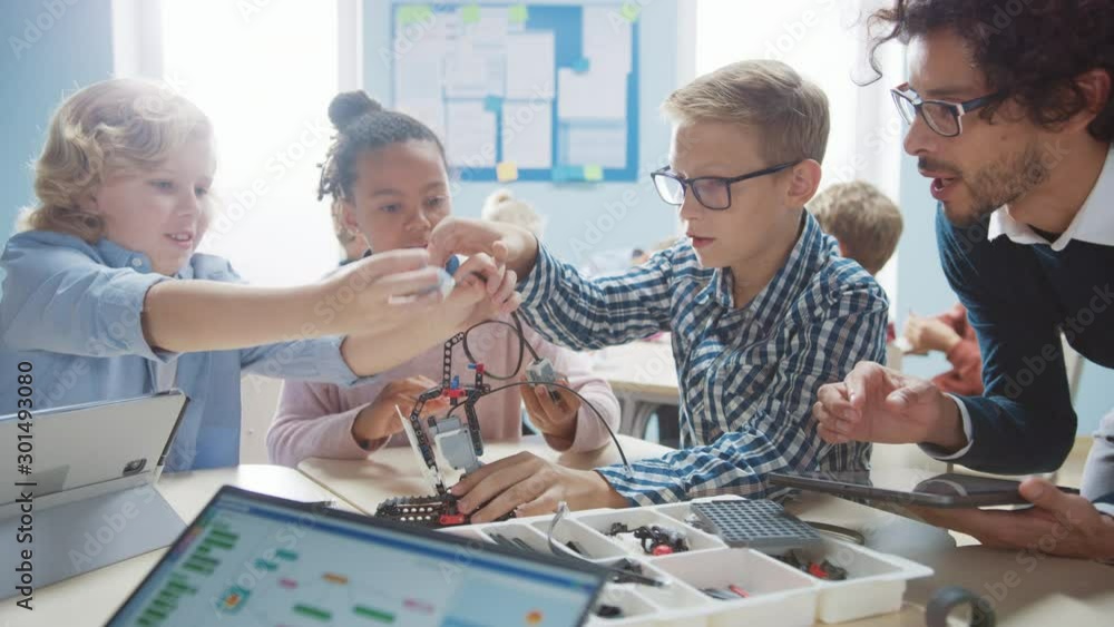 Poster elementary school robotics classroom: diverse group of brilliant children with enthusiastic teacher 