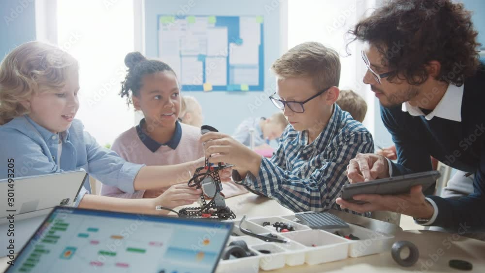 Poster elementary school robotics classroom: diverse group of brilliant children with enthusiastic teacher 