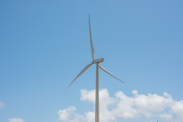 Fototapeta na wymiar Wind farm producing clean green energy