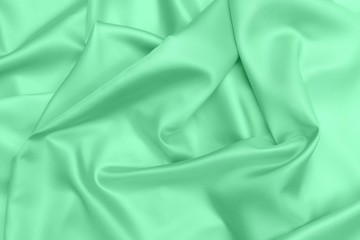 green satin fabric texture soft blur background