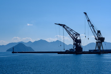 Fototapeta premium Seaview and cranes in Hiroshima port