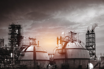 Close up of Gas storage sphere tanks in petrochemical industry or oil and gas refinery plant at night with monotone