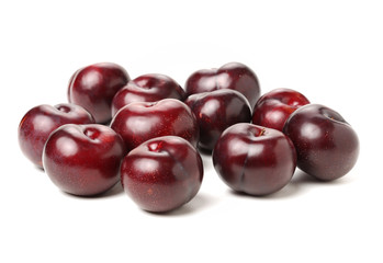 Plums on white background