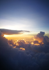 Soft clouds on the blue sky.vertical blue sky in summer.Free space for text input.The airplane window. Beautiful sky picture taken from the plane.