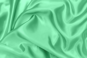 green satin fabric texture soft blur background