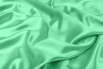 Obraz premium green satin fabric texture soft blur background