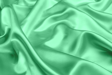 green satin fabric texture soft blur background