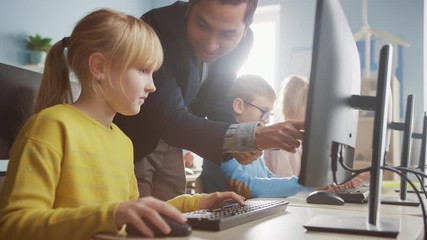 Elementary School Science Classroom: Enthusiastic Teacher Talks with a Smart Schoolboy. Using Personal Computer to Learn Programming Language and Software Coding. Children Getting Modern Education
