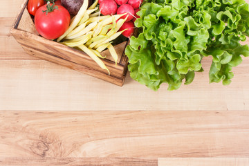 Healthy vegetables in wooden box. Source vitamins and minerals. Copy space for text on board