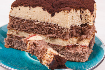 Tiramisu cake with different layers. Delicious dessert for celebrations