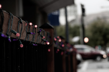 Christmas lights wrapped around outdoor banister