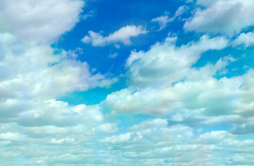 White clouds on a background of deep blue sky. 
