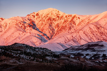 Sunrise over the snow-covered High Atlas Mountains.