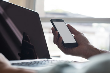 Man working on digital devices