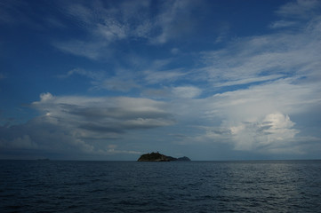 Beautiful clouds over an island on the way from Koh Tao to Chumphon, Thailand
