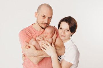 family photo on a white background: parents spend time with their children. mom and dad hug the baby. the concept of childhood, fatherhood, motherhood, IVF