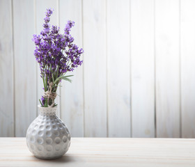 Bouquet of summer lavender on white wooden background. (top view)