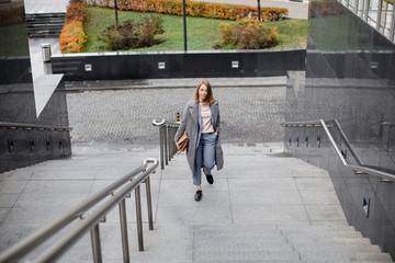  young girl in a business suit on the stairs