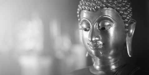 Selective focus  close-up shots of Buddha statues that are used as amulets of Buddhism