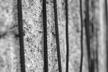 Detail of uncovered Berlin Wall concrete segment with iron rods
