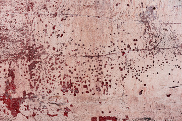 Texture of a concrete wall with cracks and scratches which can be used as a background