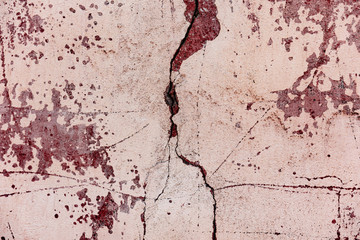 Fototapeta premium Texture of a concrete wall with cracks and scratches which can be used as a background