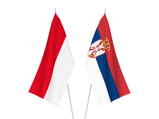 National fabric flags of Serbia and Indonesia isolated on white background. 3d rendering illustration.