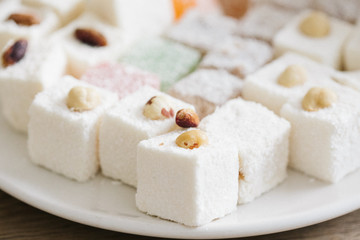 Tasty oriental sweets (Turkish delight lokum) with powdered sugar