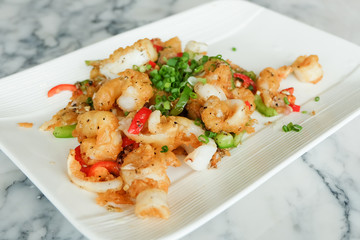 Fried squids or octopus (calamari) with chilli and garlic